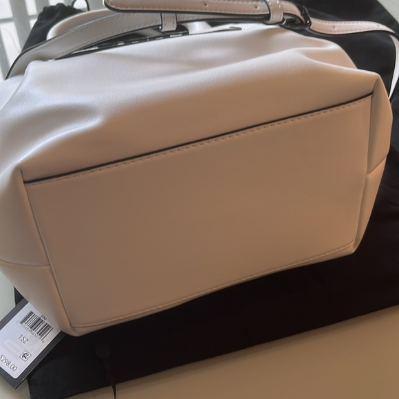 chic satchel by DKNY features multiple pockets - Picture 5 of 6